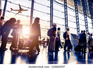 Passengers in an airport - Shutterstock ID 210042937