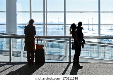 Passengers At The Airport. Woman And Child.