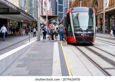 Passengers Boarding And De-boarding From Light Rail Train At Station In Sydney, Australia On 20 November 2021. Many People At Busy Tram Station Scene At Central Business District Of Sydney.