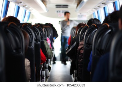 The Passengers In The Bus Which Are Tourists And Guide Of A Tour