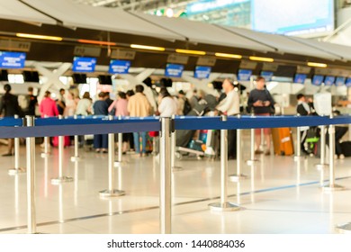 Passengers Check-in Line At The Airport On Vacation.