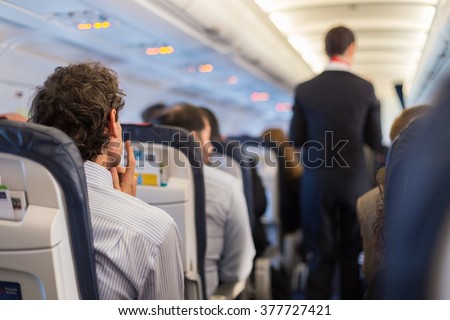 Passengers on the airplane.