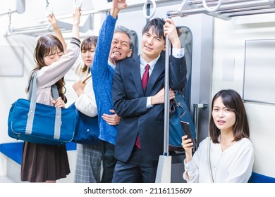 Passengers On A Crowded Train