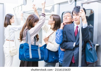 Passengers on a crowded train