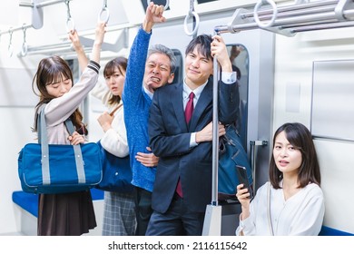 Passengers On A Crowded Train