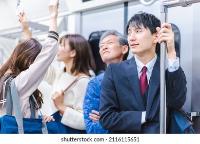 Passengers on a crowded train