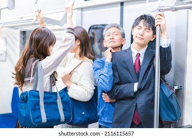 Passengers On A Crowded Train