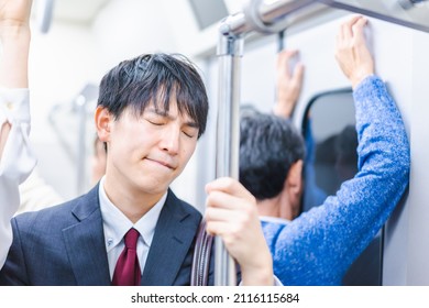 Passengers On A Crowded Train