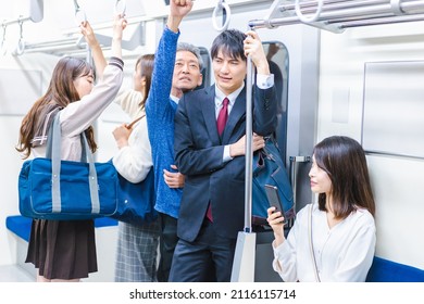 Passengers on a crowded train