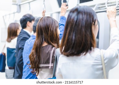 Passengers On A Crowded Train