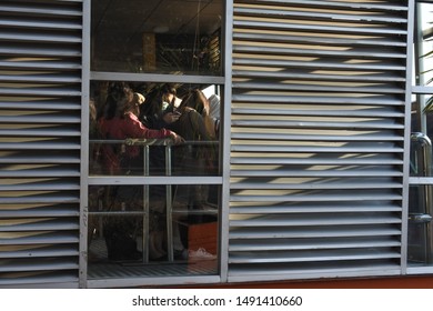 Passengers Queued To Board The Transjakarta Bus, Kalideres Bus Terminal, West Jakarta. Indonesia, August 23, 2019