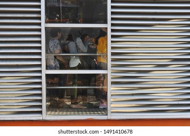 Passengers Queued To Board The Transjakarta Bus, Kalideres Bus Terminal, West Jakarta. Indonesia, August 23, 2019