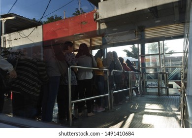 Passengers Queued To Board The Transjakarta Bus, Kalideres Bus Terminal, West Jakarta. Indonesia, August 23, 2019