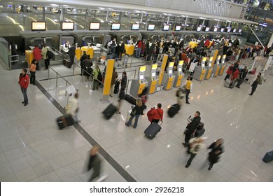 Passengers Queuing Up For Check-in