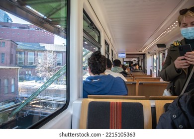 Passengers Ride In Suspended Carriage On The Wuppertal Suspended Tram In Germany