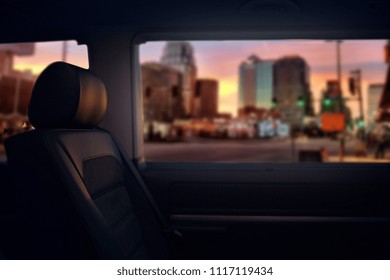 Passengers Seats And Window Of Comfortable Luxury Van. VIP Class Shuttle Van At The Evening City