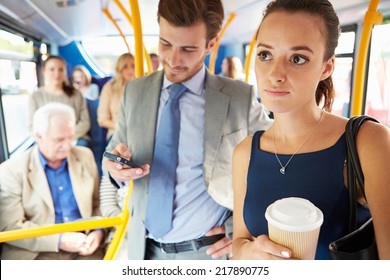Passengers Standing On Busy Commuter Bus