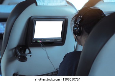 Passengers Are Using Infotainment System In The Tour Bus To Listen To Music - Blank And White Display