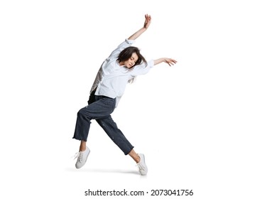 Passing. Young woman in casual wear moving dynamically isolated on white background. Flexible female ballet, contemporary dancer weightless moves. Art, motion, action, flexibility, inspiration concept - Powered by Shutterstock