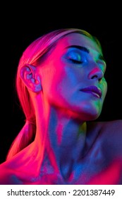 Passion  Beauty portrait young adorable woman and well  kept skin isolated over dark background in pink neon light  Concept art  fashion  style  inspiration  emotions  Copy space for ad
