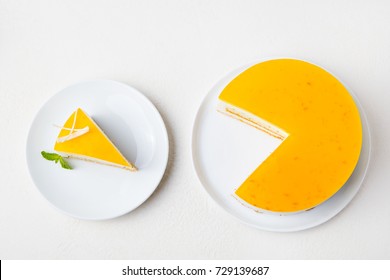 Passion Fruit Cake, Mousse Dessert On A White Plate. Top View.