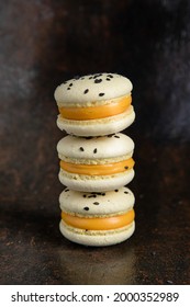 Passion fruit macarons. Rust background. Stand like a pyramid 