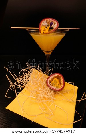 Passion fruit vodka cocktail in martini glass. tasty and fruity cocktails served in glasses