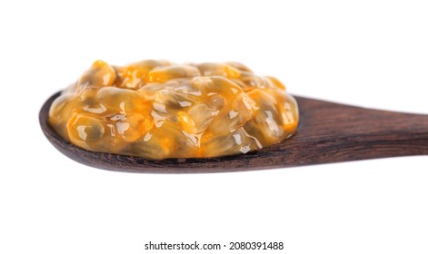 Passion Fruits Seeds In Wooden Spoon, Isolated On White Background. Passionfruit Or Maracuya Pulp, Exotic Fruit.