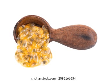 Passion Fruits Seeds In Wooden Spoon, Isolated On White Background. Passionfruit Or Maracuya Pulp, Exotic Fruit.