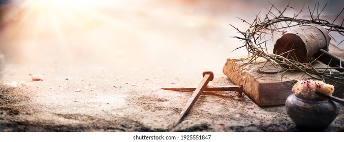 Passion Of Jesus Christ - Hammer And Bloody Nails And Crown Of Thorns On Arid Ground With Defocused Background