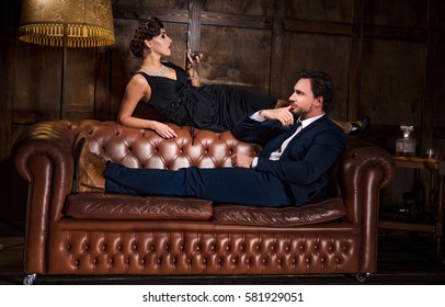Passion, relations concept. Rich businessman ready to have elegant woman with red lips. Wealth, luxury concept. Romantic atmosphere.