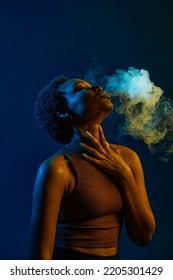 Passion Woman Blowing Smoke Curls