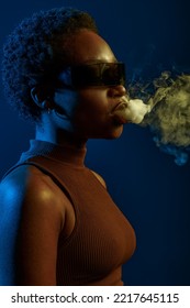 Passion Woman Blowing Smoke Curls