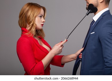 Passionate Blonde Woman In Red Touching Mans Jaw By Whip