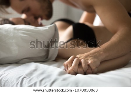 Passionate Hot Lovers Holding Hands And Kissing Making Love On Bed Sensual Couple Enjoying Intimacy Passionate Hot Lovers Holding Hands And Kissing Making Love On Bed Sensual Couple Enjoying Intimacy