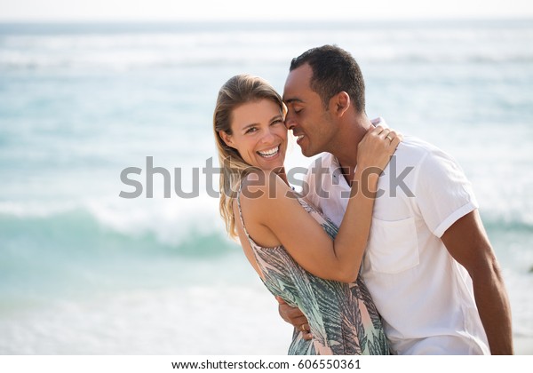 Passionate husband reaching to kiss his wife image photo