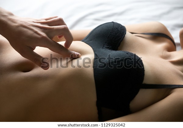 Man touch woman body in bed