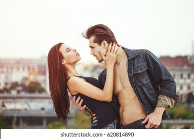 Passionate Sexy Man Holding Woman At City Outdoor Passionate Sexy Man Holding Woman At City Outdoor