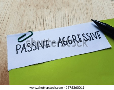 Passive - aggresive writting on table background.