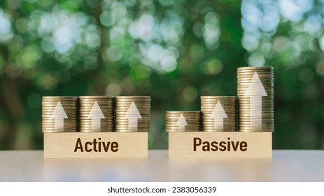 Passive income and Active income on stack coins with arrow sign. Financial freedom concept.Investment business stock growth.strategy,future,profit.