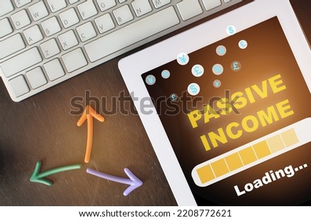 Passive income growth and online business using digital tablet or smartphone. Financial technology concept and success planning for retirement idea