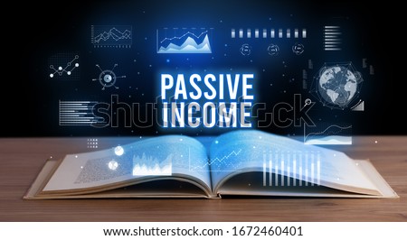 PASSIVE INCOME inscription coming out from an open book, creative business concept
