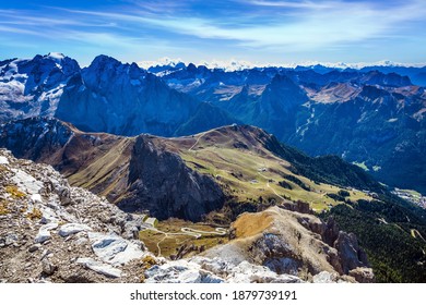 The Passo-Pordoi pass. Pordoi is a mountain pass of the Dolomites, located between the Sella mountain range and the Marmolada mountain. Warm sunny day in the Alps  - Shutterstock ID 1879739191