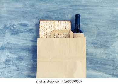 Passover Grocery Shopping Composition With A Matzah Or Matza And Red Kosher In A Paper Shopping Bag. Top View Or Overhead View Composition With Copy Space

