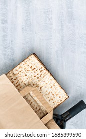 Passover Grocery Shopping Composition With A Matzah Or Matza And Red Kosher In A Paper Shopping Bag. Top View Or Overhead View Composition With Copy Space

