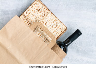 Passover Grocery Shopping Composition With A Matzah Or Matza And Red Kosher In A Paper Shopping Bag. Top View Or Overhead View Composition With Copy Space

