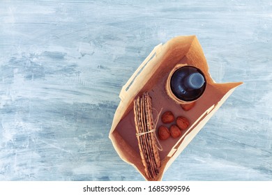 Passover Grocery Shopping Composition With A Matzah Or Matza And Red Kosher In A Paper Shopping Bag. Top View Or Overhead View Composition With Copy Space

