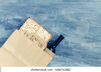 Passover Grocery Shopping Composition With A Matzah Or Matza And Red Kosher In A Paper Shopping Bag. Top View Or Overhead View Composition With Copy Space

