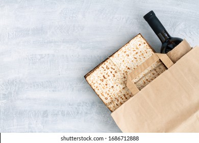 Passover Grocery Shopping Composition With A Matzah Or Matza And Red Kosher In A Paper Shopping Bag. Top View Or Overhead View Composition With Copy Space

