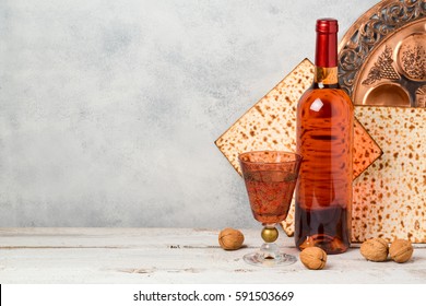 Passover holiday concept with wine and matzoh over rustic background